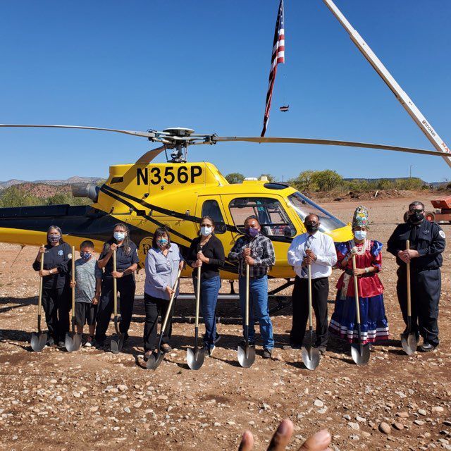 Ground breaking pic in front of helicopter